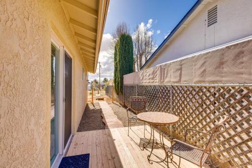 a patio with a table and chairs next to a building at Kingman Vacation Rental with Yard and Fire Pit in Kingman