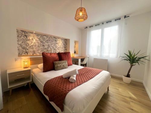 Postel nebo postele na pokoji v ubytování Le Carrel, Centre de Rennes