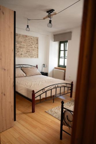 a bedroom with a bed and a brick wall at Villa Maria in Pašman