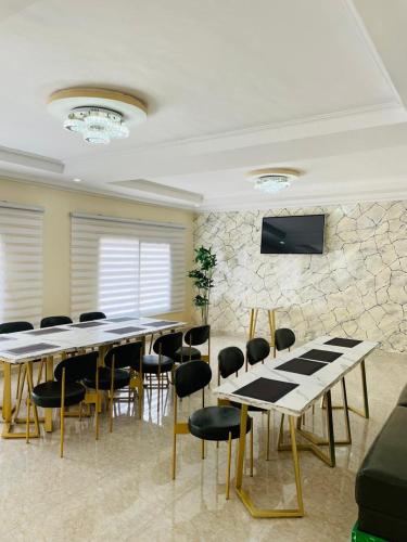 a conference room with a long table and chairs at Les HOTELS TALHAYA, NOUAKCHOTT in Nouakchott