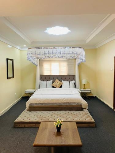 a large bedroom with a large bed with a window at Les HOTELS TALHAYA, NOUAKCHOTT in Nouakchott
