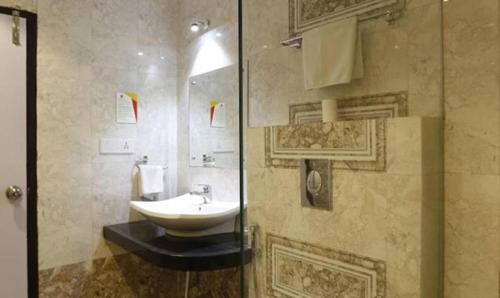 a bathroom with a sink and a shower at FabHotel Prime Rester Select in Jodhpur