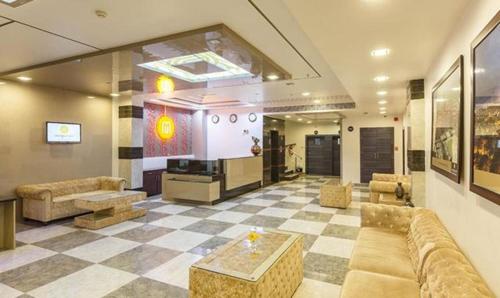 a large living room with a couch and a table at FabHotel Prime Rester Select in Jodhpur