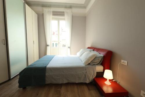 Postel nebo postele na pokoji v ubytování Nebbiolo Apartment