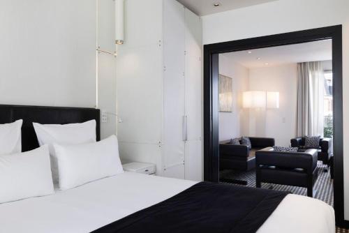 Hôtel Félicien & Spaにあるベッド