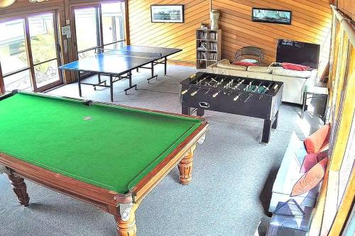 a living room with two ping pong tables in it at 11 Whitecrest Great Ocean Road Resort - Ocean View in Apollo Bay