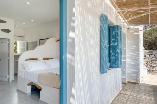 a bedroom with a bed in a room at Politimis Studio N2 in Amorgos