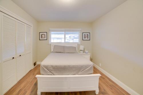 a white bedroom with a bed and a window at Quiet Salinas Vacation Rental 10 Mi to Beach in Salinas