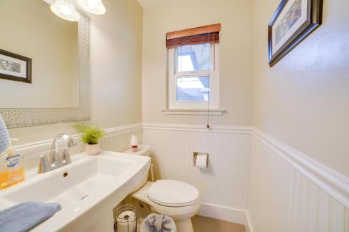 a white bathroom with a toilet and a sink at Quiet Salinas Vacation Rental 10 Mi to Beach in Salinas