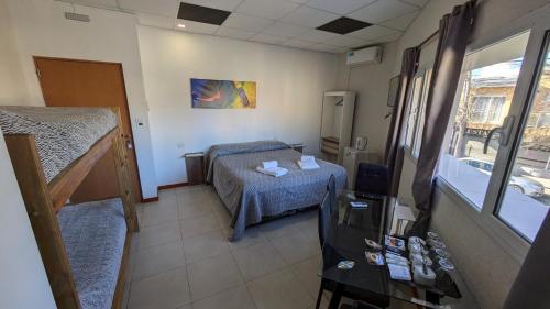 Postel nebo postele na pokoji v ubytování Tres Arroyos Suite