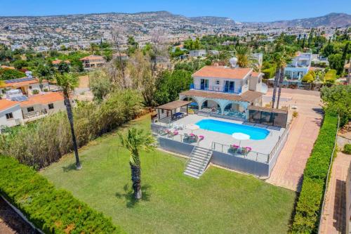 an aerial view of a house with a swimming pool at Villa Danae Coral Bay by Villa Plus in Peyia