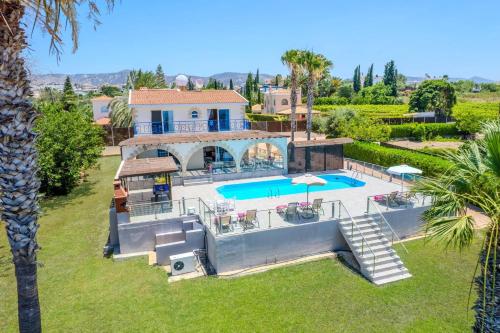 an aerial view of a villa with a swimming pool at Villa Danae Coral Bay by Villa Plus in Peyia