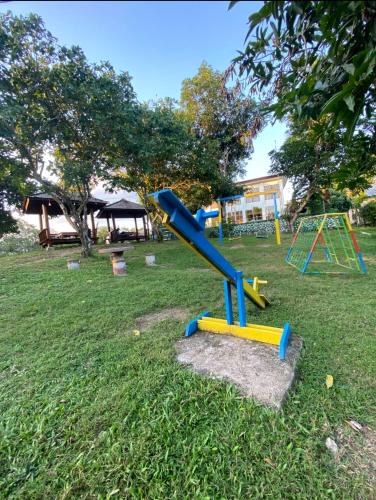 a group of playground equipment in a park at Hakata Lejja near Natural Hot spring in Batu-Batu
