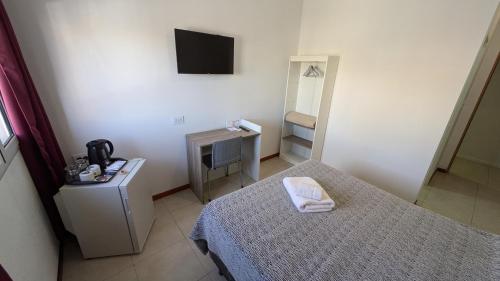 Postel nebo postele na pokoji v ubytování Tres Arroyos Suite