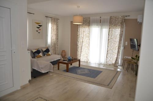 a living room with a couch and a table at Irida Home in Ioannina