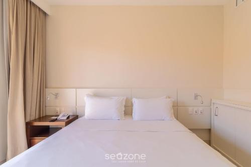 Postel nebo postele na pokoji v ubytování Estúdios Modernos em Resort pé na areia - Jurerê Beach Village JBVJR