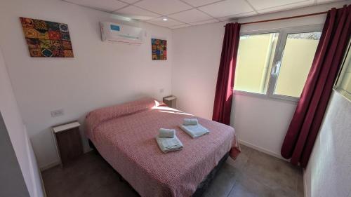 Postel nebo postele na pokoji v ubytování Tres Arroyos Suite