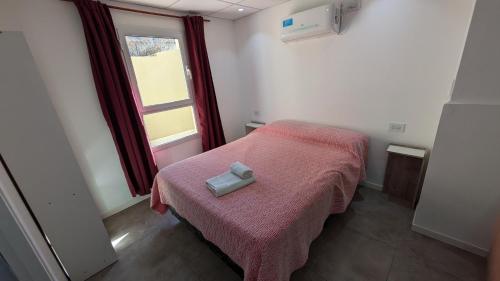 Postel nebo postele na pokoji v ubytování Tres Arroyos Suite