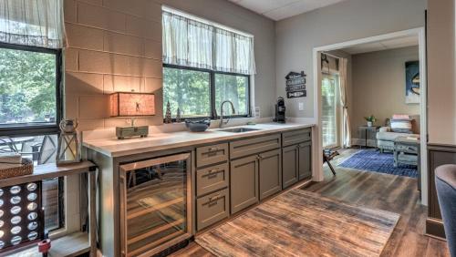 a kitchen with a sink and a counter top at Treehouse on the Lake in Blairsville