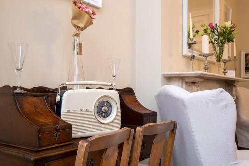a room with a table with a radio on it at Host & Stay - Brunswick Sea View in Brighton & Hove