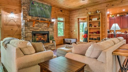 a living room with a couch and a fireplace at Memory Maker in Blue Ridge