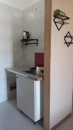 Η κουζίνα ή μικρή κουζίνα στο Trulli & Case Fichi 3