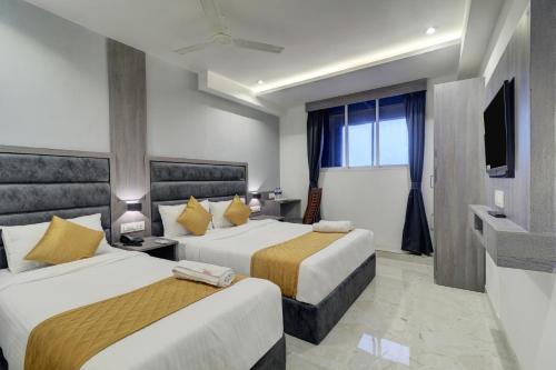 Postel nebo postele na pokoji v ubytování Hotel Isra International, BKC