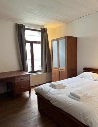 En eller flere senge i et værelse på CasaVerde Family House With Duplex Suite