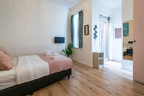 a bedroom with a bed and a large window at Aparthotel North Studio With Patio For 2 in Amsterdam
