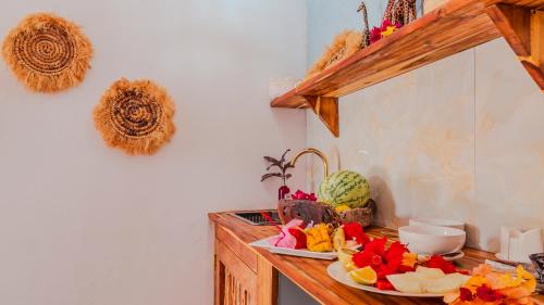 a kitchen counter with a plate of food on it at TIANDE Boutique Hotel in Pwani Mchangani