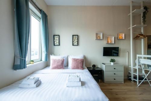 Ένα ή περισσότερα κρεβάτια σε δωμάτιο στο Aparthotel North Spacious Studio for two