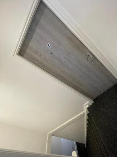 a white ceiling with a window in a room at Pc homes room C in Hyde