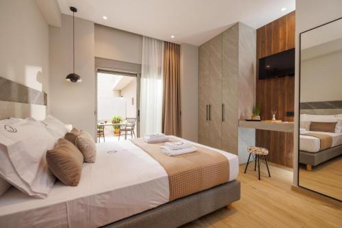 Ένα ή περισσότερα κρεβάτια σε δωμάτιο στο Jolly Suites