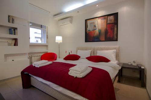 Studio Apartment Picasso में एक कमरे में एक या कई बेड