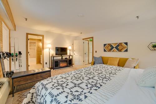 a bedroom with a large bed and a television at Ski-InandSki-Out Boyne Mountain Resort Rental! in Boyne Falls