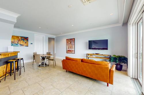 a living room with a couch and a table at BrightWater Blue 158-2 in Clearwater Beach