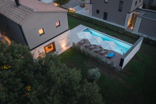 an aerial view of a house with a swimming pool at Design Villa Istar in Bale