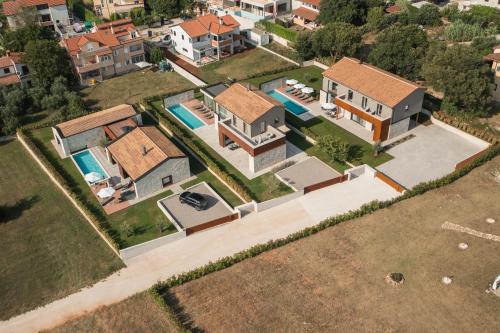 an aerial view of a house with a swimming pool at Design Villa Istar in Bale