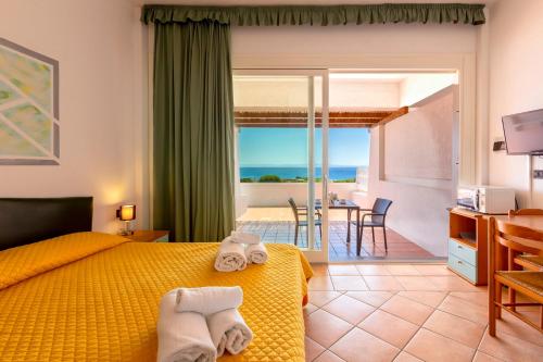 A bed or beds in a room at Residence Le Vele