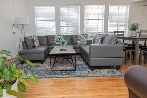 a living room with a couch and a table at Beach Place Hotel in Miami Beach