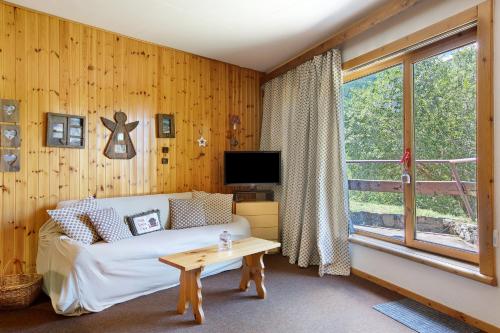 a living room with a couch and a window at Casa Franco - Pila Appartamenti in Pila