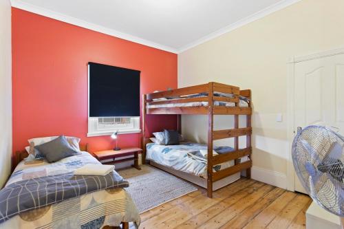 a bedroom with two beds and a bunk bed at 4-Bed 3-Bath Sunset Haven in Sunset Strip