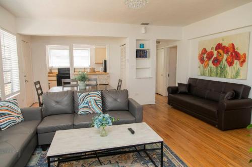 a living room with a couch and a table at Beach Place Hotel in Miami Beach