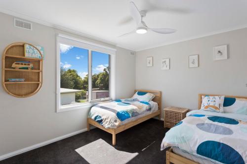 Ένα ή περισσότερα κρεβάτια σε δωμάτιο στο Imollu Beach House 5-Bed 2 5-Bath