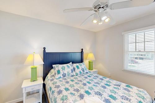 a bedroom with a bed and a ceiling fan at Turtle #21B-CAC in Buxton