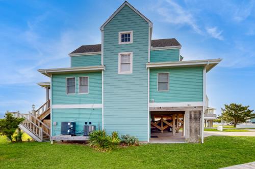 a blue house with a gambrel at Turtle #21B-CAC in Buxton