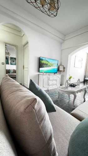 a living room with a couch and a table at CALAYS Tu hogar junto al mar in Tangier
