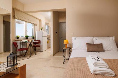 Ένα ή περισσότερα κρεβάτια σε δωμάτιο στο Jolly Suites