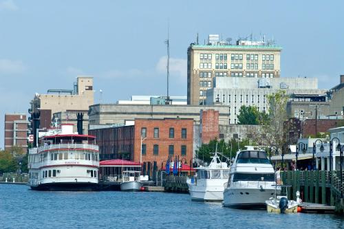three boats docked in the water in a city at River View Condo 602 & 603 in Wilmington