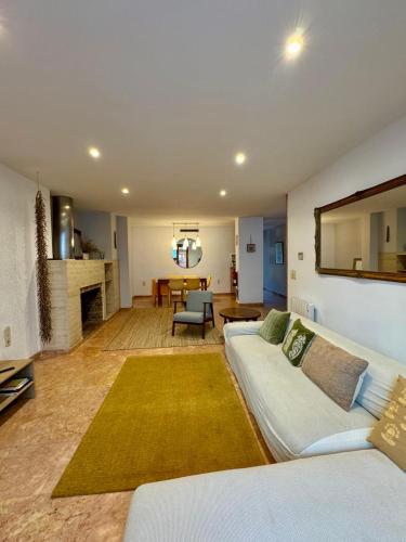 a living room with a white couch and a table at N28 in Xàtiva